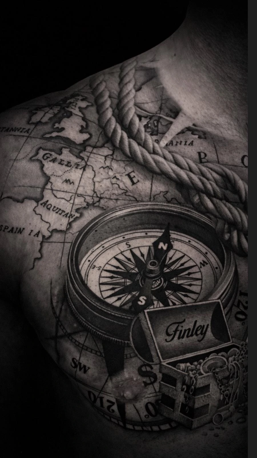 black & grey realism compass over weathered treasure map with Finley script across chest