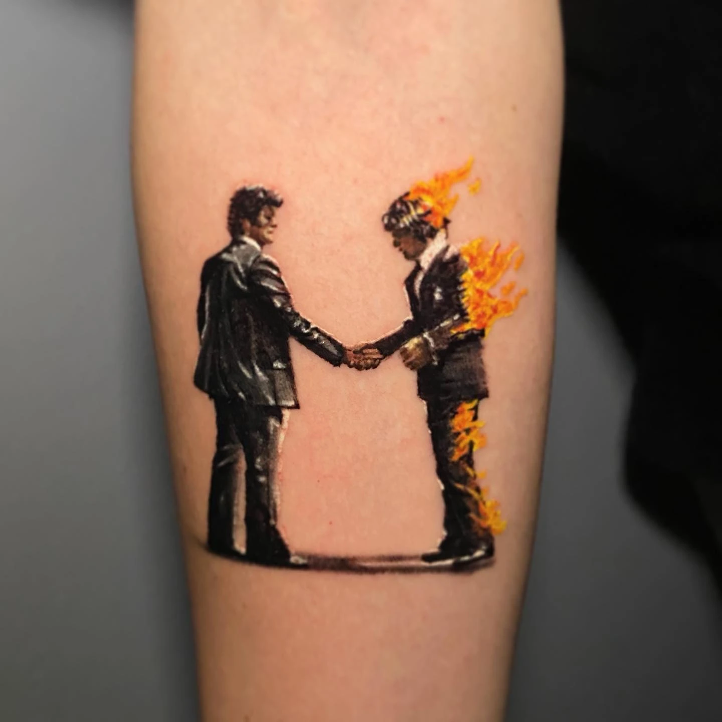 Pink Floyd 'Wish You Were Here' suit + man on fire handshake