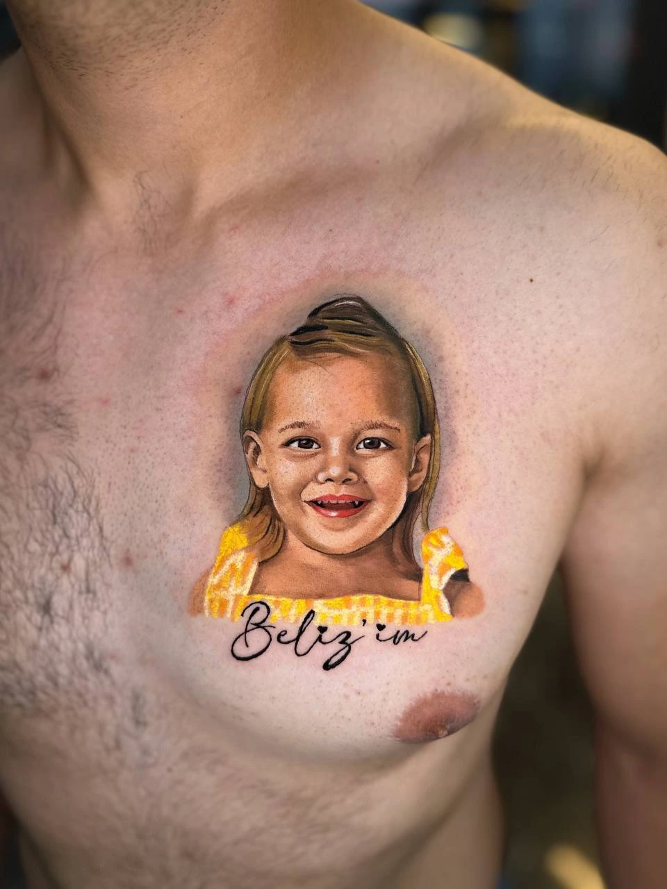 Color photoreal child portrait with 'Beliz'im' script (memorial)