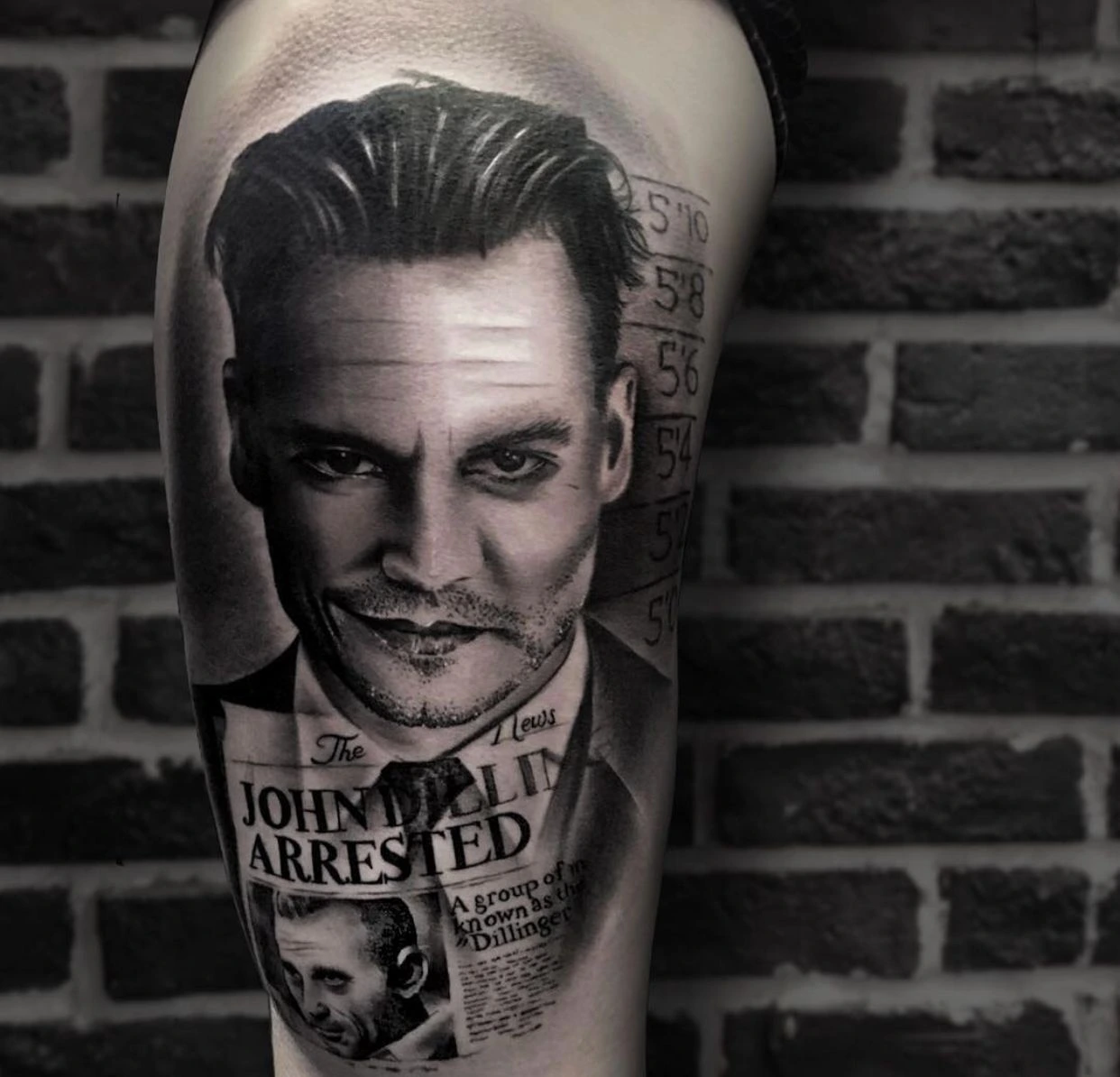 Johnny Depp as John Dillinger with newspaper headline 'Dillinger Arrested' and police height ruler