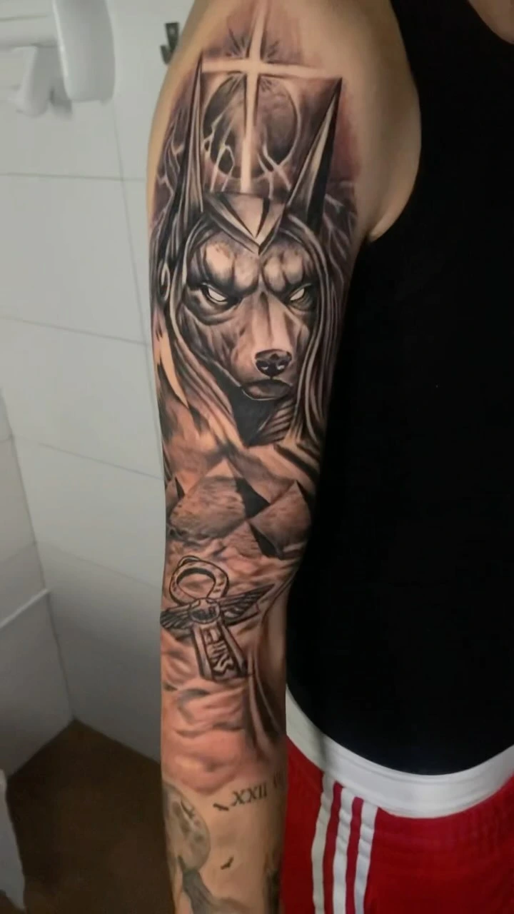 Anubis with cross/halo, pyramids, ankh keys — full sleeve