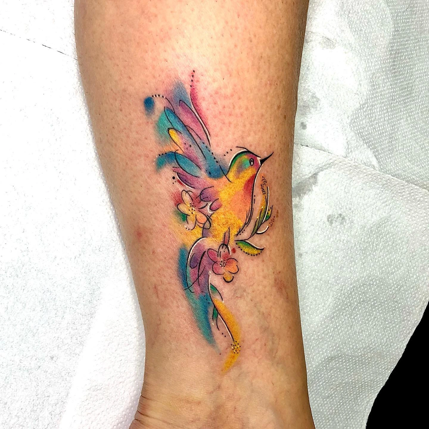 Watercolor hummingbird with flowers
