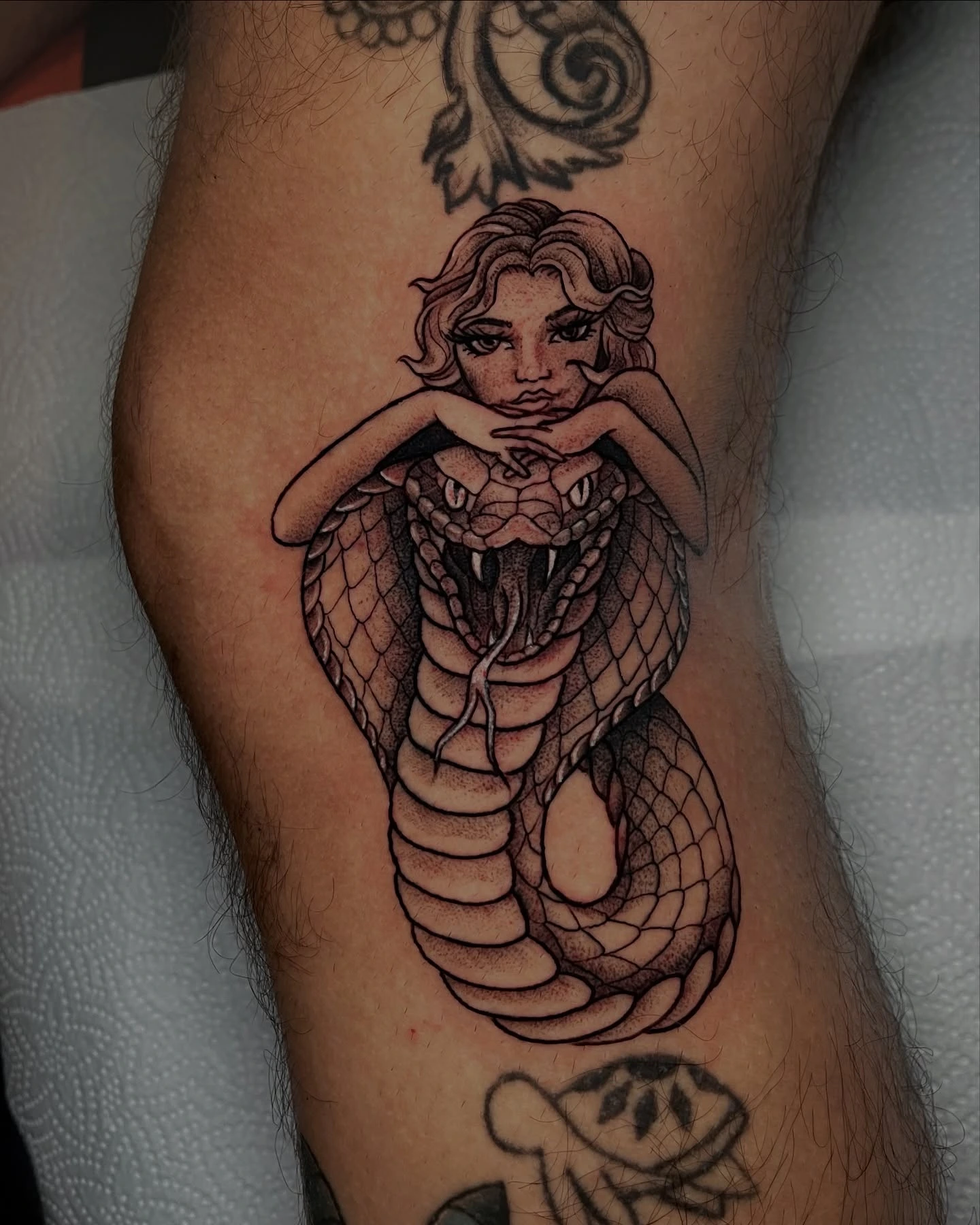 Snake-woman hybrid: woman's head on cobra body