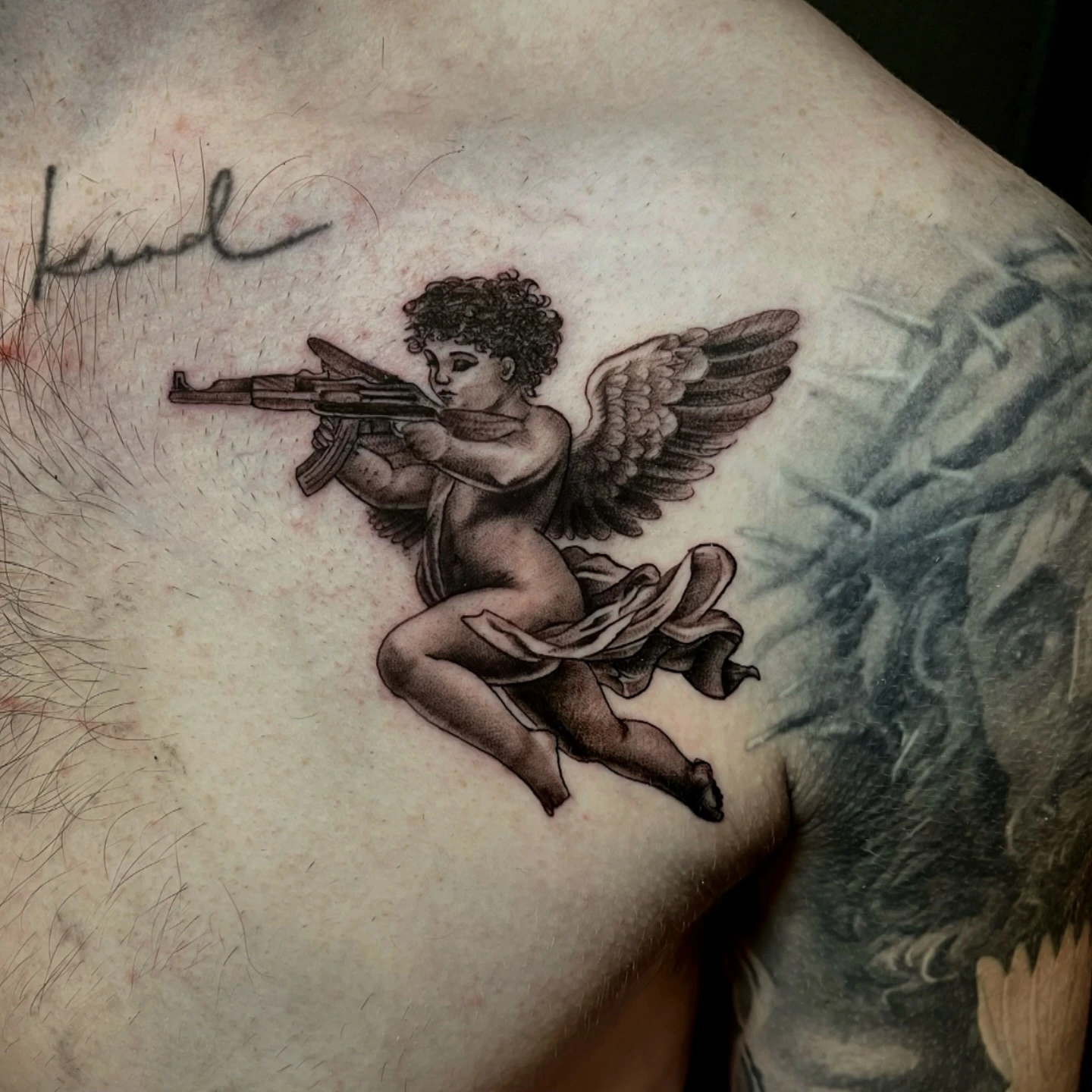 Cherub angel firing AK-47