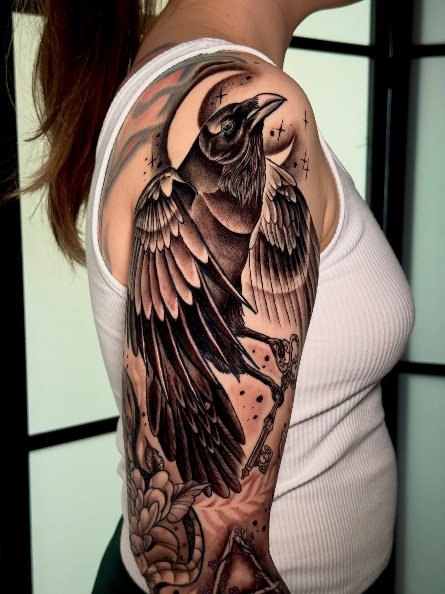 Neotrad raven with key dangling from beak