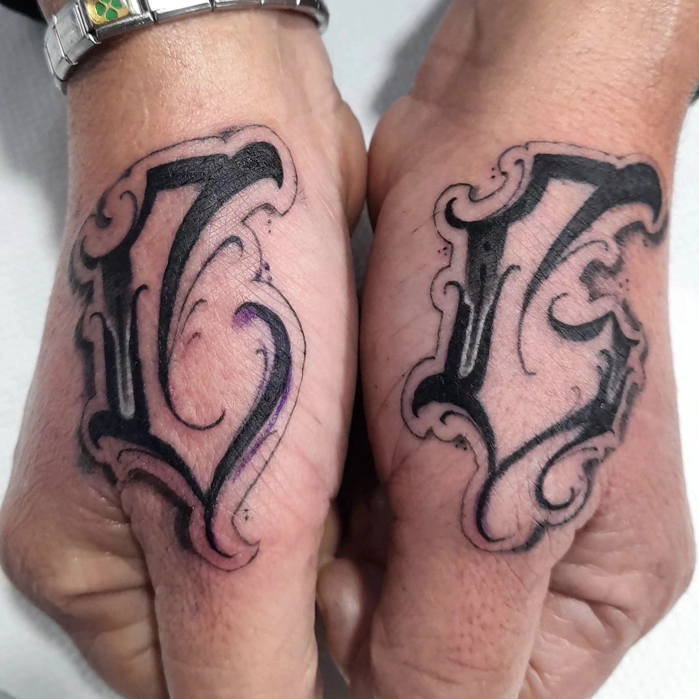 Heavy outlined dimensional letter detail (close-up)