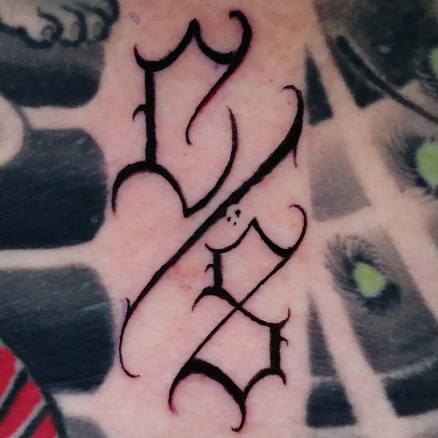 Chicano filigree letter detail (close-up)