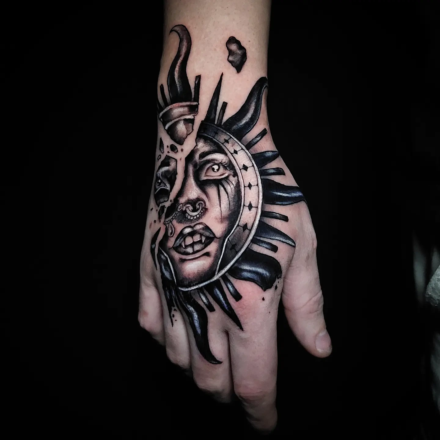 Sun-and-moon/woman face on hand