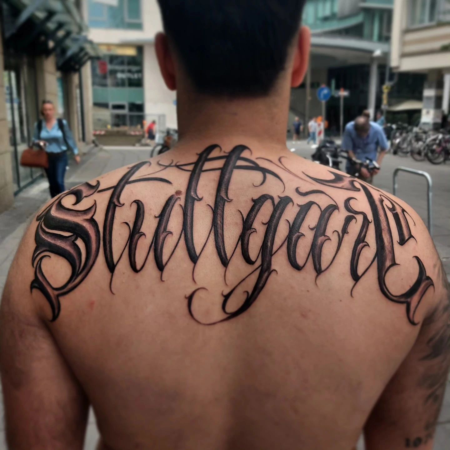 'Stuttgart' chicano filigree script across upper back