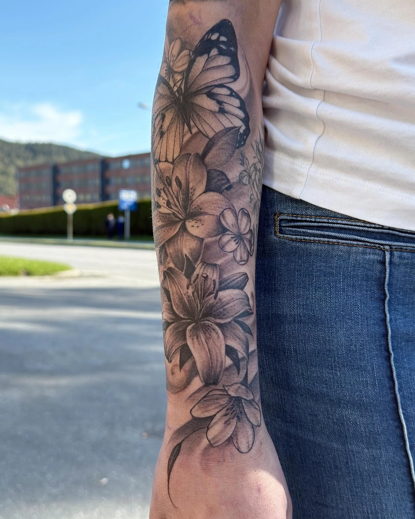 Lily/butterfly fineline-realism floral half-sleeve