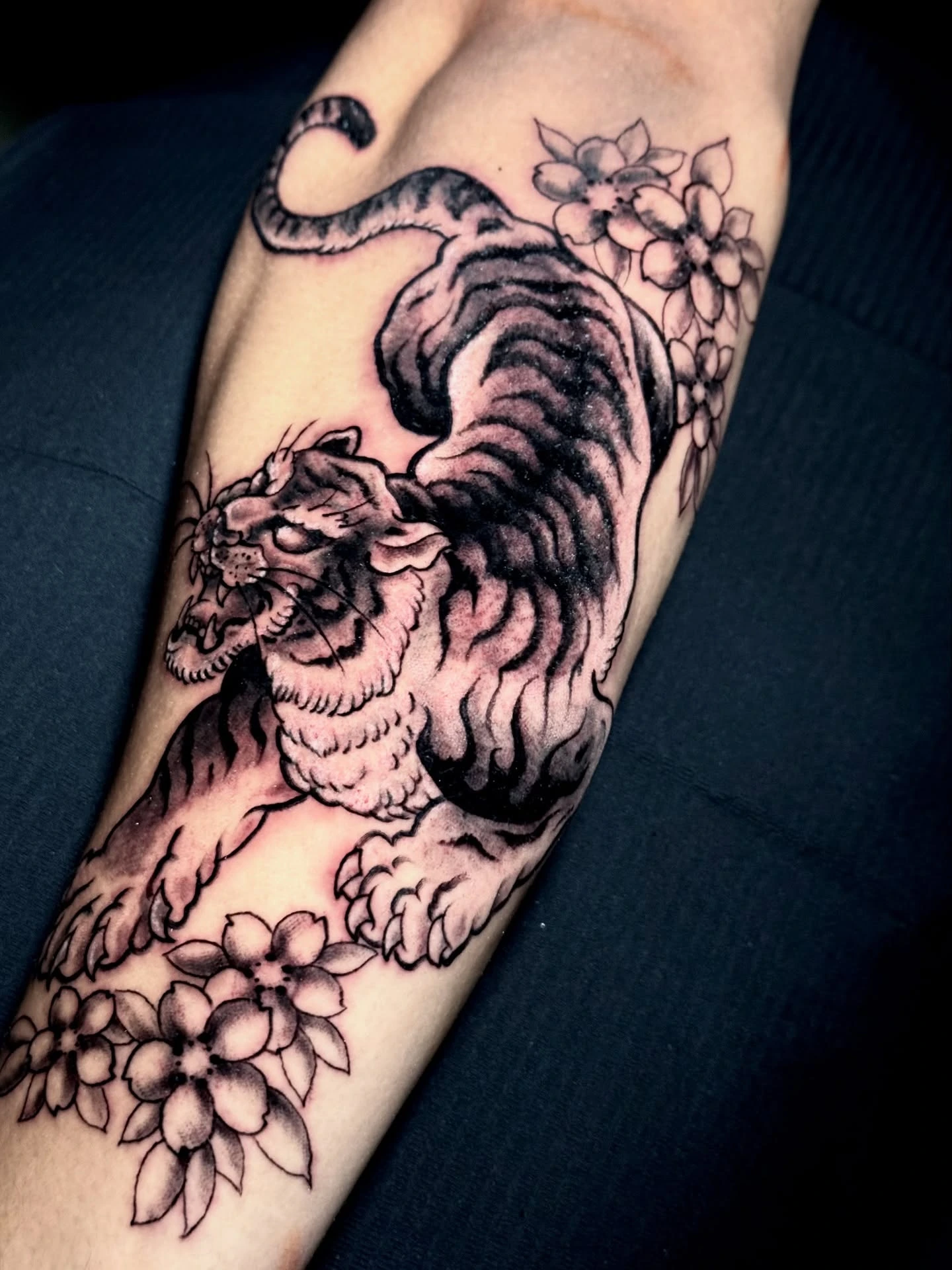 Surreal woman face emerging from rose on hand