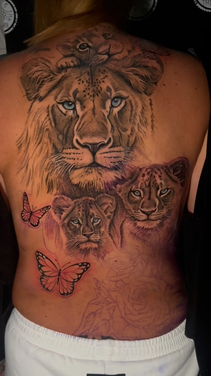 Lioness with two cubs and leopard cub, butterflies + ghost-line roses