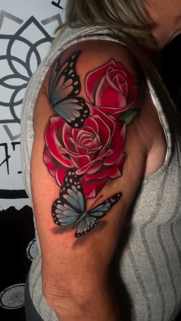 Two pink/red roses with monarch butterflies, classic neo-trad rose