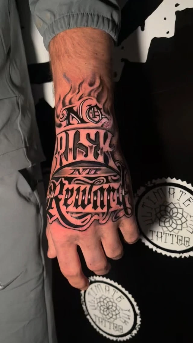 'No Risk No Reward' Old English script with flame top