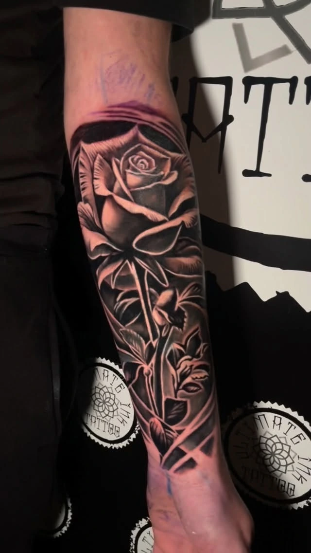 Layered photoreal black-and-grey roses with thorny stems