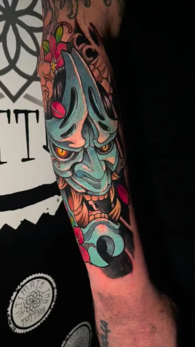 Hannya mask in teal/orange with cherry blossoms