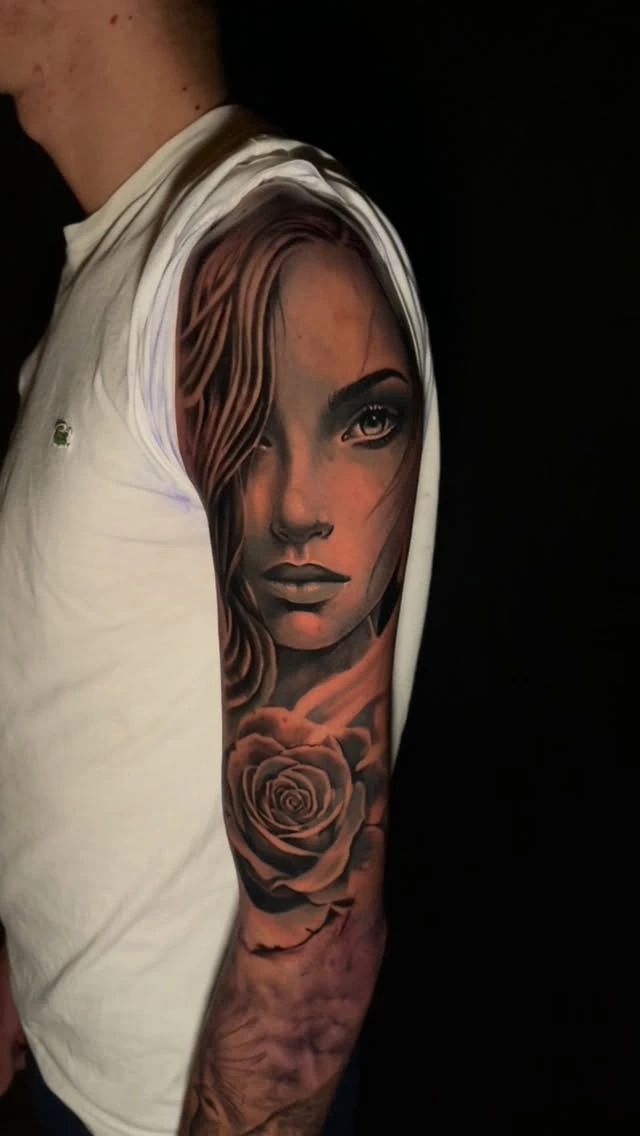 Female face portrait with rose below, draped hood/hair