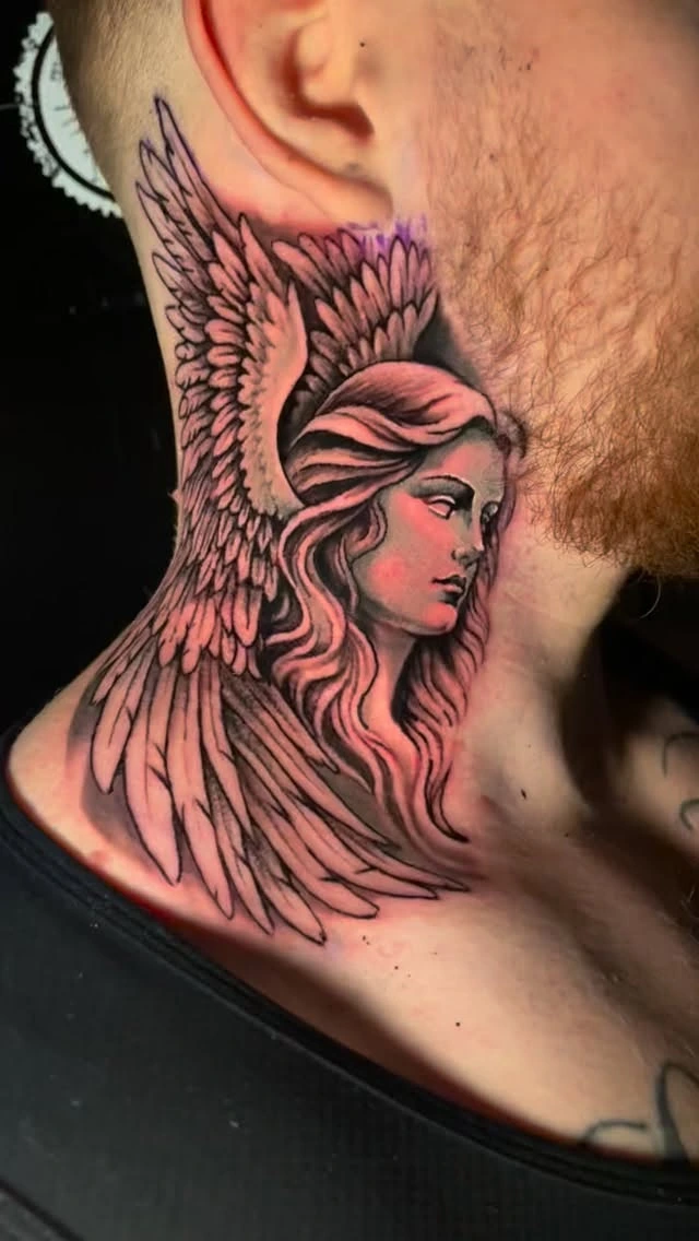 Female angel/Valkyrie with one large wing wrapping the neck
