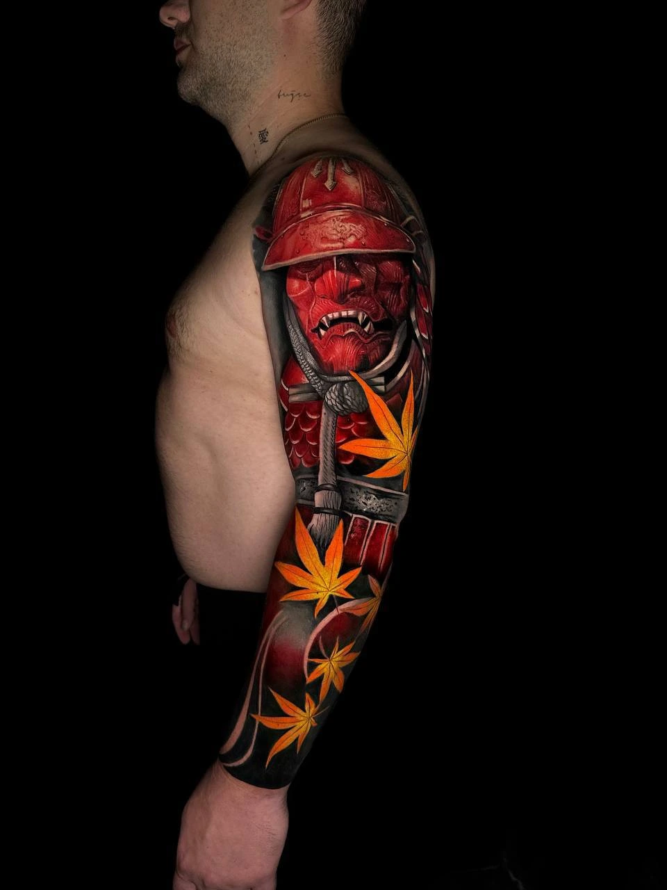 Red samurai (akaoni) helmet and mask with falling maple leaves (momiji), full sleeve