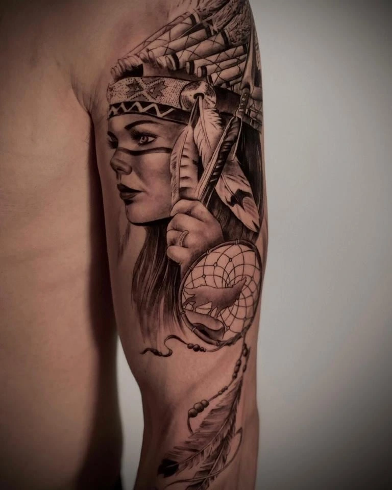 Native American woman with feathered headdress and dreamcatcher