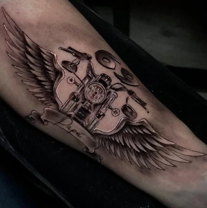 winged motorcycle engine with 'Papá' banner (memorial)